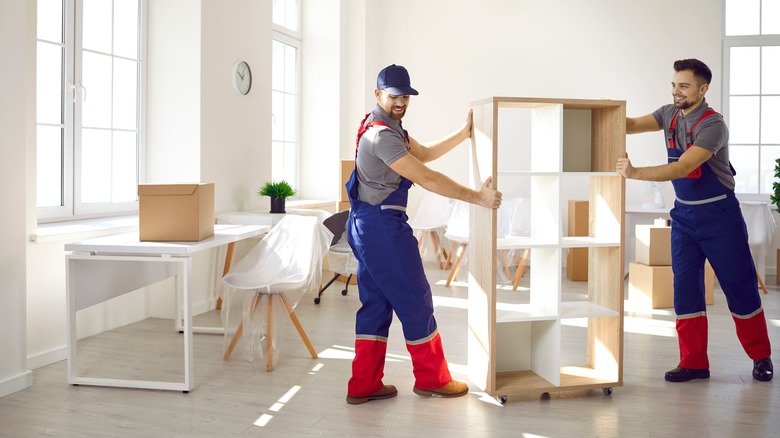 Professional movers moving furniture