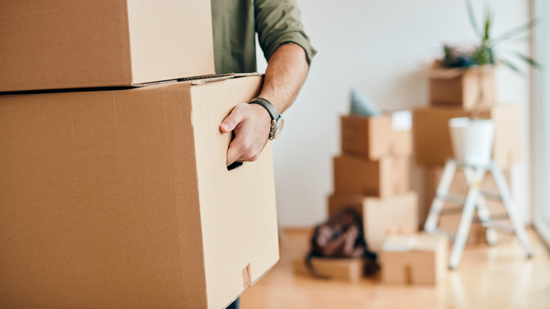 Person carrying moving box