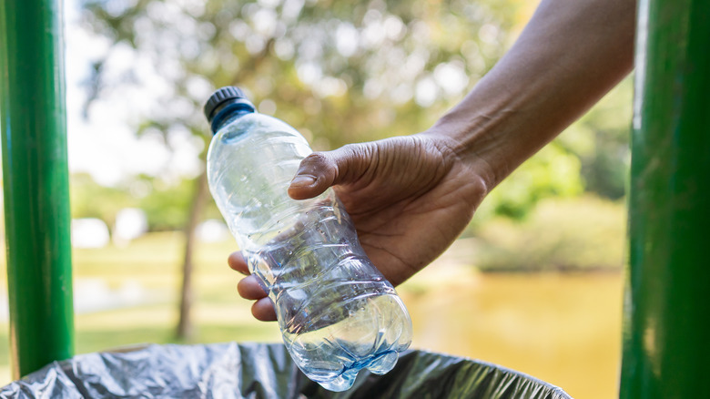 Empty water bottle in hand