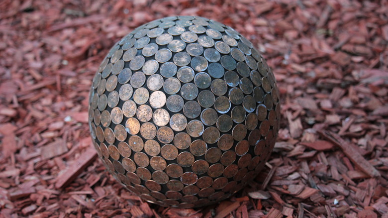 penny ball in red mulch