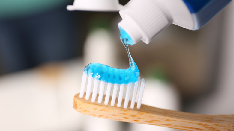 toothpaste applied on toothbrush