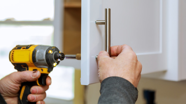 drill screwing in cabinet handles