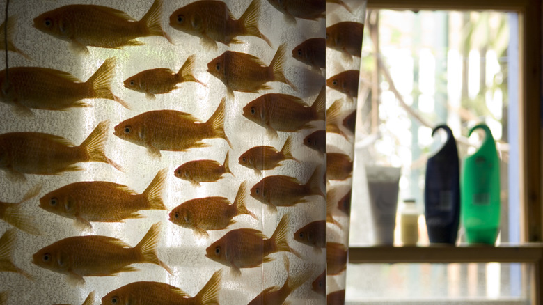 shower curtain decorated with goldfish