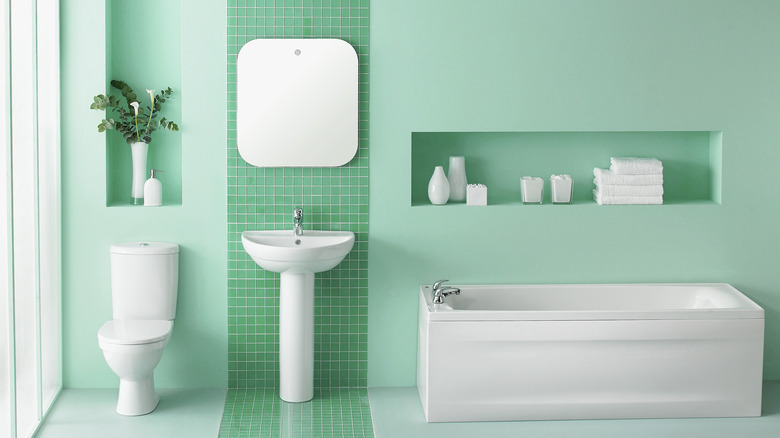 Bathroom with bright mint green walls