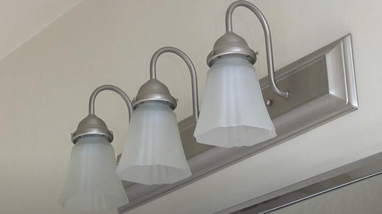 White bell trio vanity lights