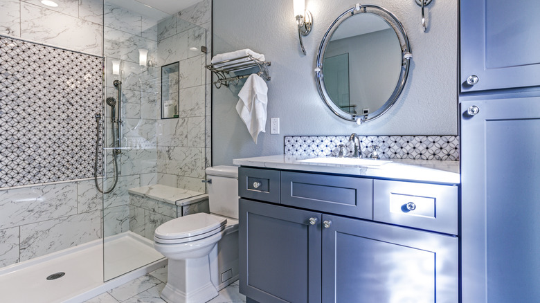 bathroom with blue cabinets