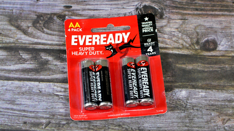 A package of Eveready batteries on a wood plank surface