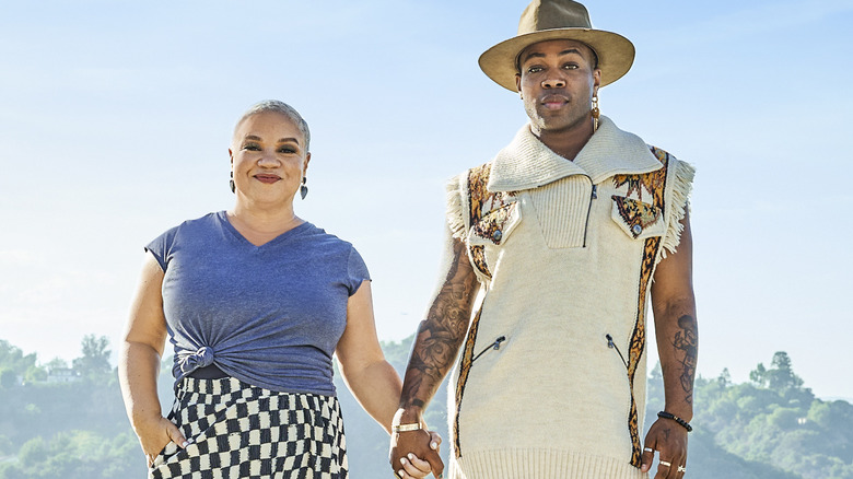 Kim Myles and Todrick Hall hold hands