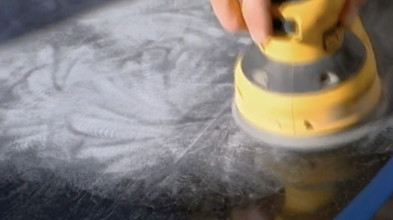 sanding down the table