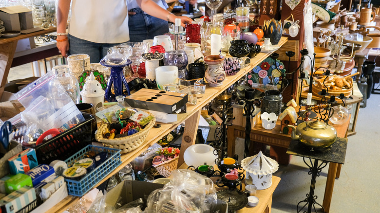 A person looks at thrift shop glass