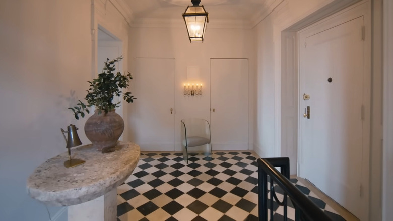 Black and white floor tiling on Nate Berkus and Jeremiah Brent's landing