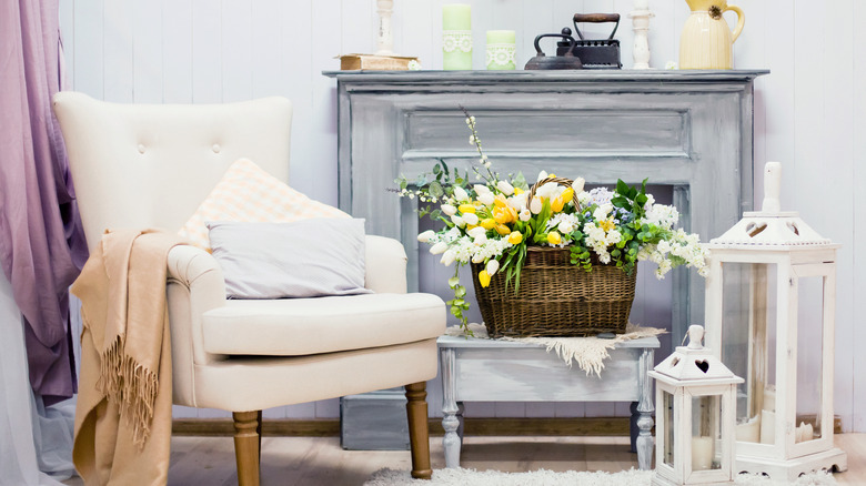 Lanterns next to gray fireplace 