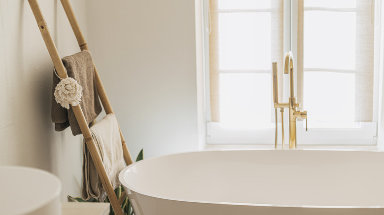 beige bathroom with gold faucet