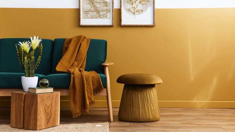 couch with wood table and leather stool