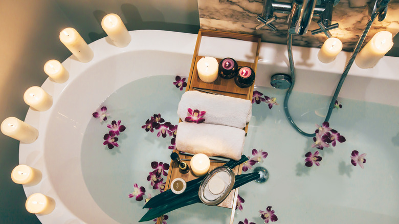 Bathtub with candles on lip