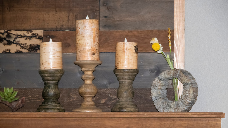 Candles on a wooden mantel 