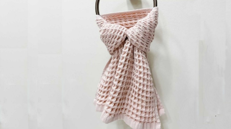 Pink waffle towel hanging like a bow tie