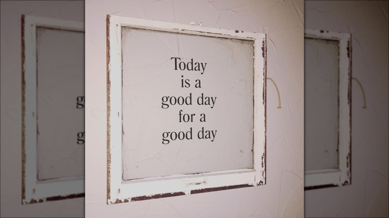 motivational window sign on wall