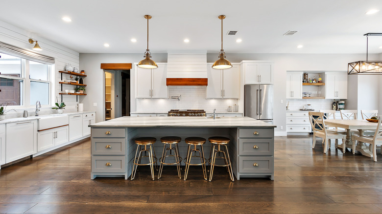 Open kitchen design that features large island with storage