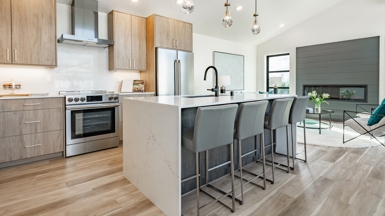 White marble kitchen island in modern kitchen with seating