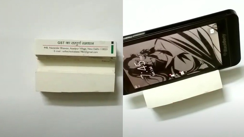 Split images with business cards on one side and phone holder on the other