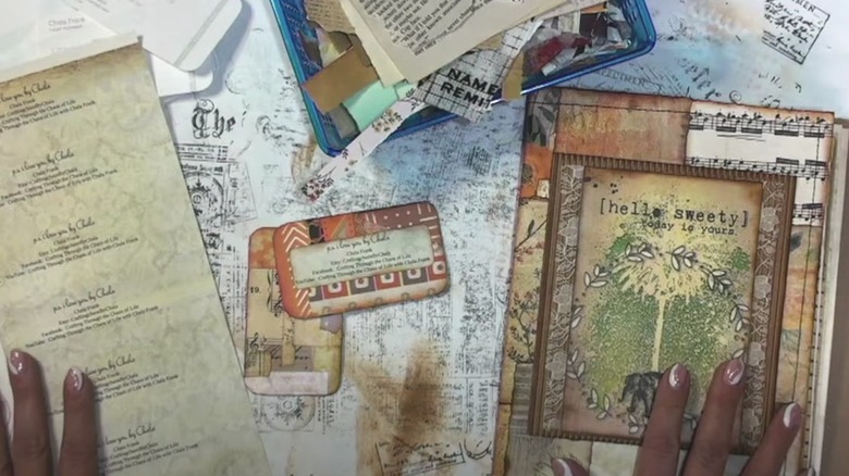 Various decorative pieces of paper and cards for junk journaling