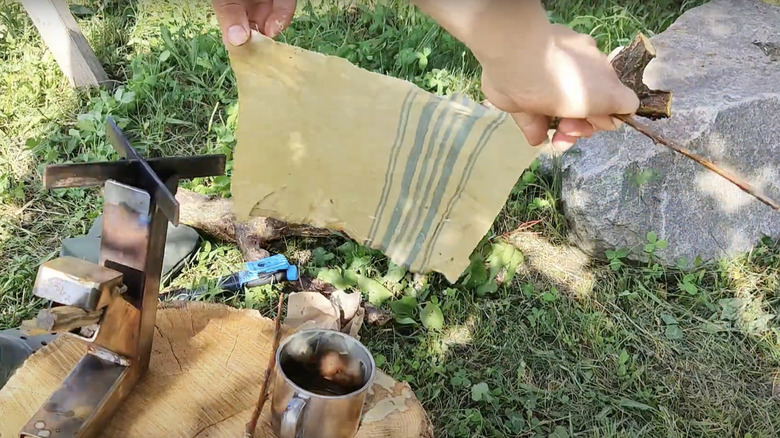 Making a beeswax wrap made from an old cloth napkin.