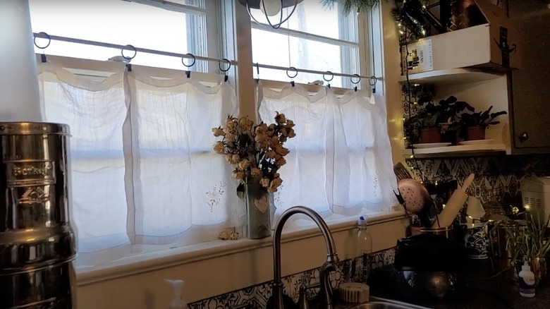 Kitchen window curtains made from cloth napkins.