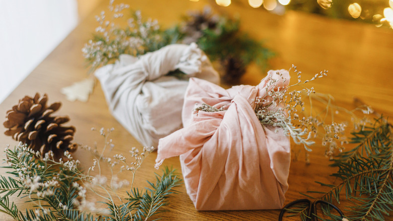 Two wrapped gifts in upcycled cloth napkins.