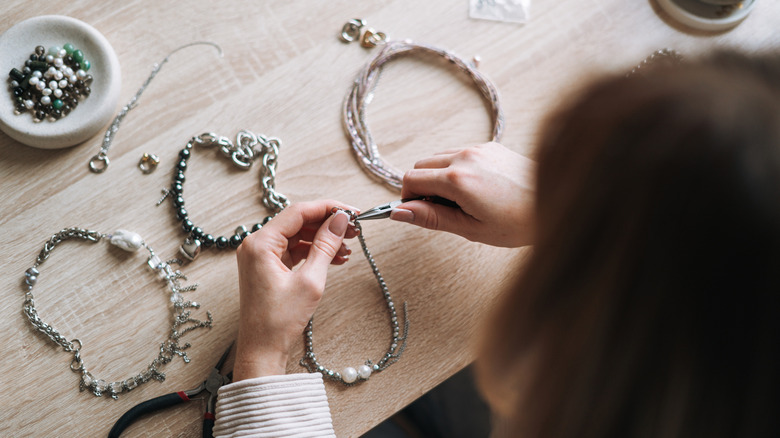 A woman making jewelry