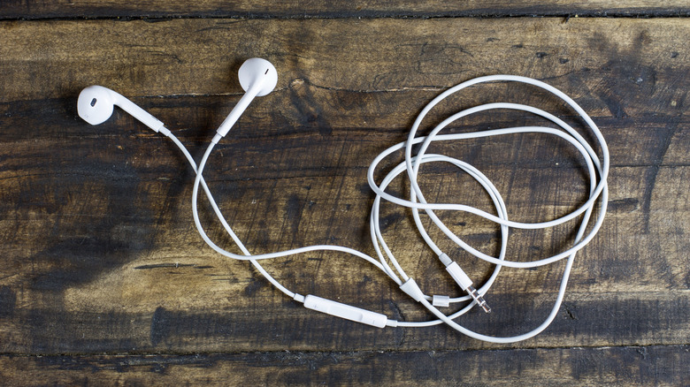 White earbuds on a wood table