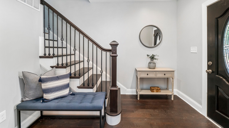 Entryway with a bench and console table