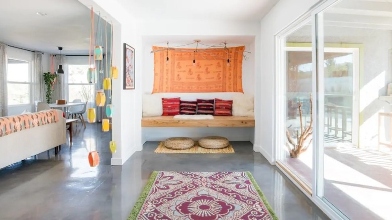 bohemian entryway with a tapestry 