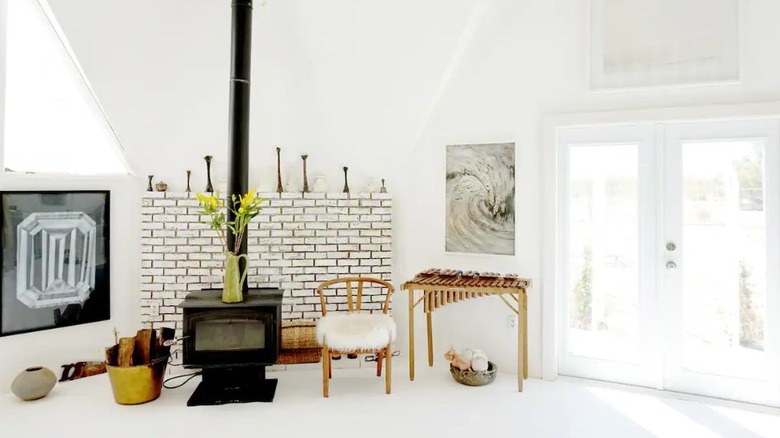 white brick wall wood stove