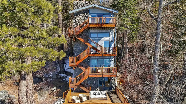 four story home at lake edge