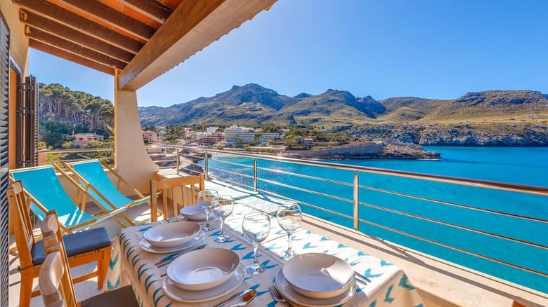 table overlooking turquoise water 