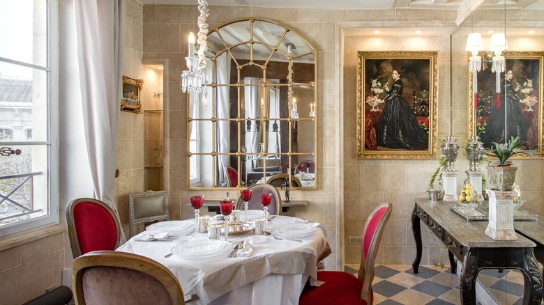 vintage dining room with red chairs 