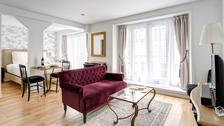 velvet maroon couch in living room