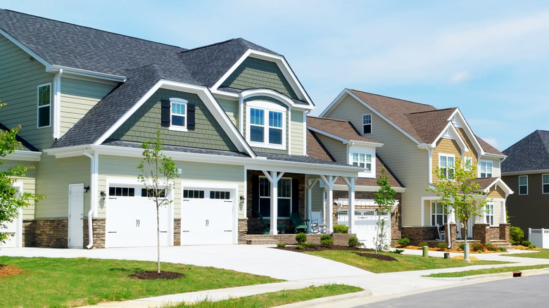 suburban street with siding houses