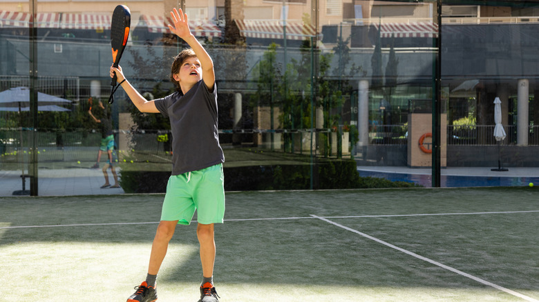 boy at tennis court