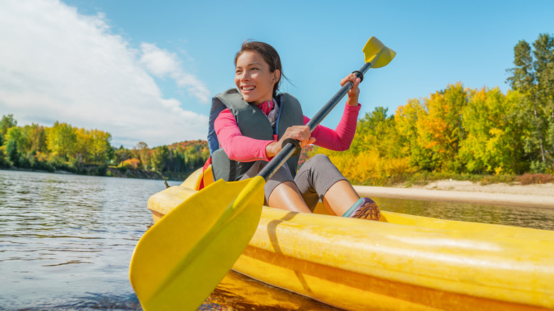 Woman kayaking on the river.