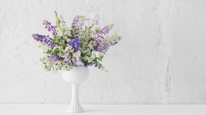 Tall white epedestal vase