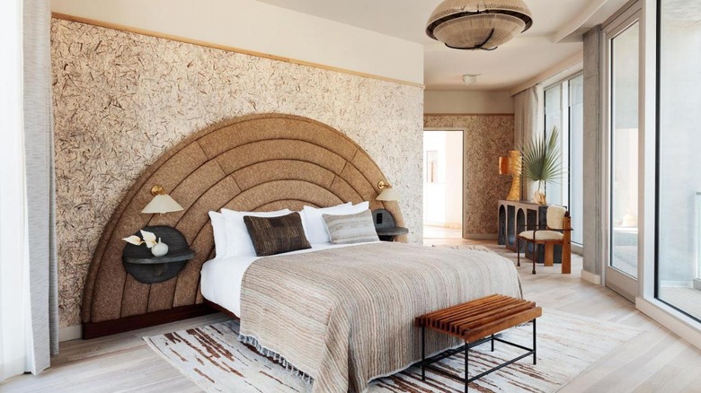 bedroom with ornate headboard