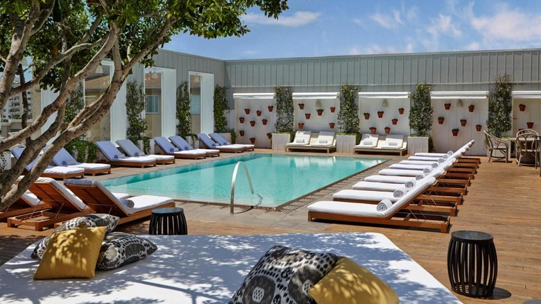 pool with white lounge chairs 