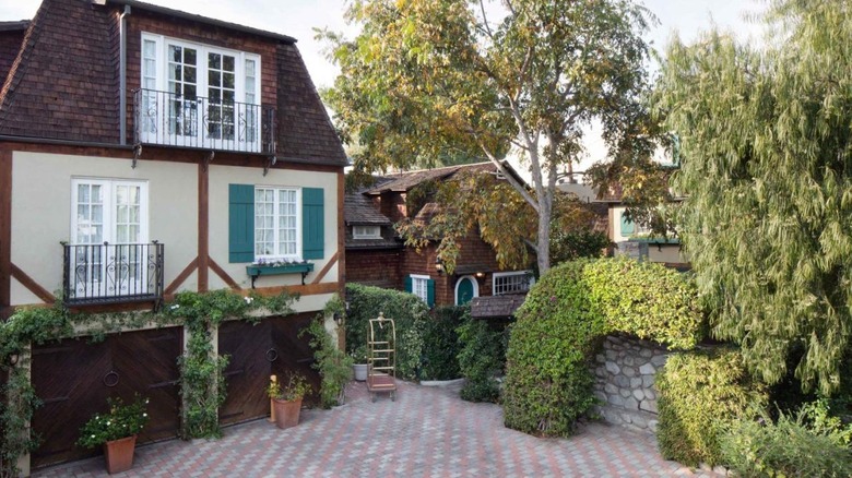 cottage-style exterior with greenery