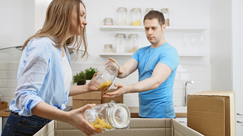 couple packing a box