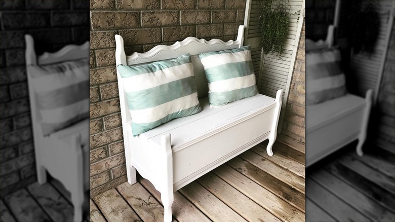 White bench with pillows