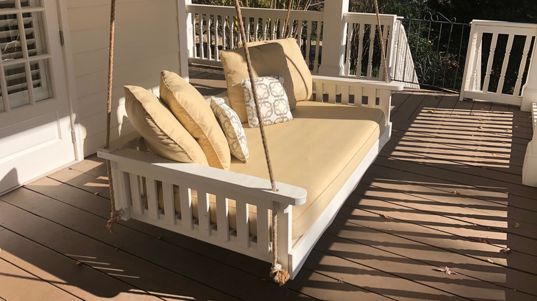 White swinging porch bed