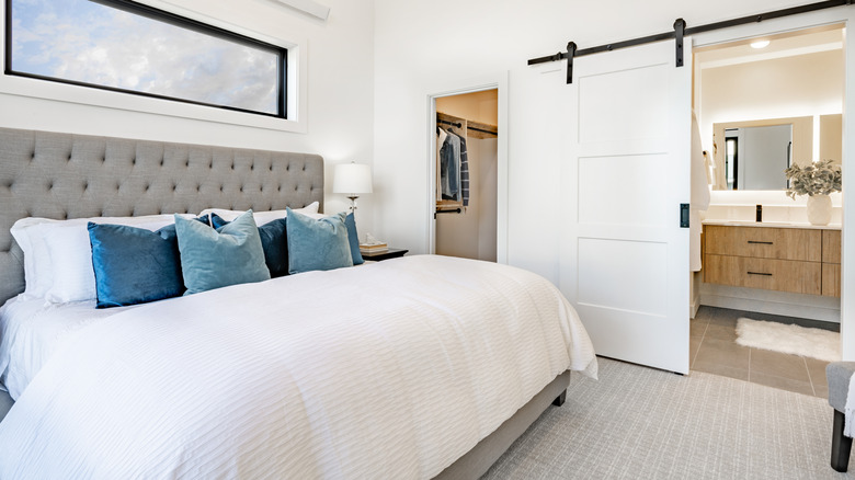 Bedroom with barn door closet door