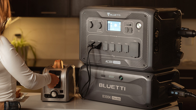 BLUETTI AC300 sitting on a kitchen counter powering a toaster.